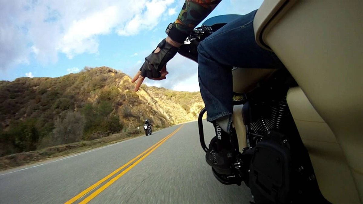 Why Do Motorcycle Riders Wave with Two Fingers Down?